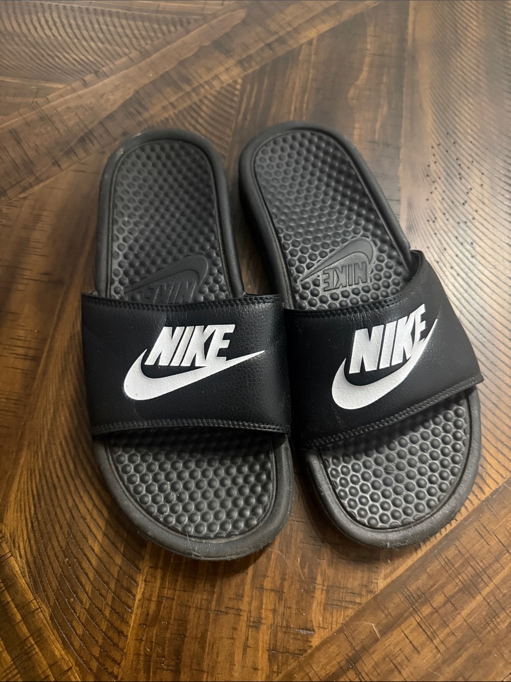 Nike Black Slide Sandals with White Swoosh Accent